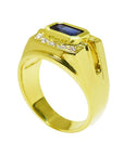 Men's 18K yellow gold ring with east-west bezel-set blue sapphire and diamond accents.