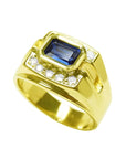 Men's 18K yellow gold ring with east-west bezel-set blue sapphire and diamond accents.