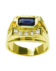 Men's 18K yellow gold ring with an east-west bezel-set dark blue sapphire and diamond accents.