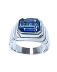 Blue sapphire ring for men emerald cut east west bezel set with a vivid medium blue color crafted in 18K white gold.