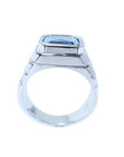 Men's 18K white gold ring with a 5.76 ct. emerald-cut blue sapphire in a bezel setting.