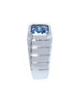 Men's 18K white gold ring with a bezel-set, emerald-cut vivid blue sapphire.