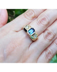 Men's 14K yellow gold ring with emerald cut blue sapphire and two round side diamonds.