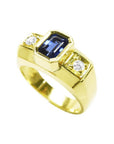 Men's 14K yellow gold ring with a bezel-set emerald cut blue sapphire and two round side diamonds.