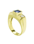Men's 14K yellow gold ring with an emerald cut blue sapphire and two round side diamonds.