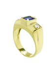 Men's 14K yellow gold ring with an emerald cut blue sapphire and two round side diamonds.