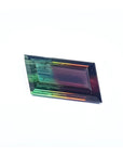 Fancy cut 8.30 carat Brazilian Watermelon Tourmaline gemstone with vibrant red-orange and bluish-green bicolor.