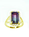 14K gold ring with a rectangular 5.60 ct. green and pink watermelon tourmaline, surrounded by diamonds.