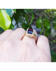 Watermelon tourmaline ring with sparkling green and pink 5.60 ct. gemstone in 14K gold, worn on a hand.