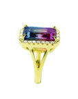 The pink and green of this tourmaline ring are visibles fron the top to side down split shank profile.