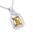 Right side top view of a natural yellow sapphire pendant necklace halo diamond 18k white gold