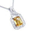Natural yellow sapphire pendant necklace, the gemstone displays a vibrant medium-deep yellow-orange hue halo diamond 18k white gold.