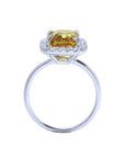 Emerald cut 4.59 ct yellow sapphire ring with diamond halo in 14K white gold.