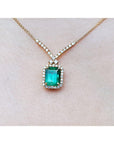 Emerald necklace fo women in usa emerald-cut natural emerald deep green bluish color, encircled by a halo diamond