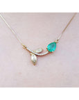 Real Emerald necklace for women sourced from Muzo mines; nature inspired design handcrafted in 14k yellow gold