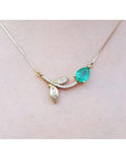 Real Emerald necklace for women sourced from Muzo mines; nature inspired design handcrafted in 14k yellow gold