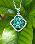 14K white gold cluster necklace with natural Colombian emeralds and diamond 4-leaf clover design.