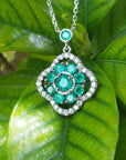 14K white gold cluster necklace with natural Colombian emeralds and diamond 4-leaf clover design.