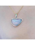 Ethiopian opal necklace pendant with red/orange fire, free-form cabochon, 14K yellow gold setting.