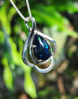 Teardrop 4.30 ct Ethiopian black opal pendant in sterling silver with multicolor flashes.