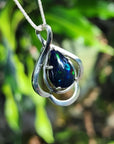 Teardrop 4.30 ct Ethiopian black opal pendant in sterling silver with multicolor flashes.