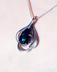 4.30 ct teardrop Ethiopian black opal pendant in sterling silver with multicolor flashes.