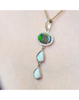Opal pendant necklace on a person's neck