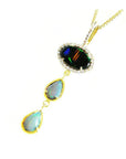 Black and white Australian opal pendant with three opals in 14K yellow gold.