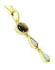 Gold pendant with natural opals gemstones on a white background.