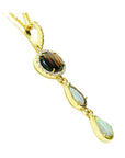 Black and white Australian opal pendant in 14K yellow gold with diamonds, featuring an oval and two pear-shaped opals.