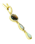 Black and white Australian opal pendant in 14K yellow gold with diamonds, featuring an oval and two pear-shaped opals.