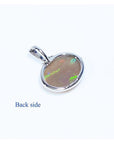 Back of 2.25 ct Australian opal pendant in 14K white gold, showing solid semitransparent white crystal.