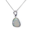 Opal pendant on a white gold chain against a white background