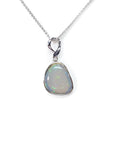 Freeform bluish-green Australian opal pendant, bezel set in 14K white gold on a silver chain.