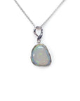 Freeform bluish-green Australian opal pendant, bezel set in 14K white gold on a silver chain.