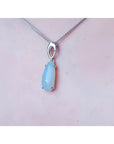 Pear-shaped 2.12 ct. white opal solitaire pendant in 14K white gold on a silver chain.