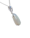 Pear-shaped white opal solitaire pendant with green flashes, set in 14K white gold on a chain.