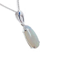 Pear-shaped white opal solitaire pendant with green flashes, set in 14K white gold on a chain.