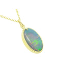 Oval-cut 3.41 ct Australian opal pendant with green-bluish rainbow play, set in 14K yellow gold.