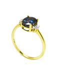 14K yellow gold ring with a vibrant oval blue sapphire and two natural diamonds on each side.