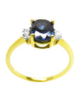14K yellow gold women's ring with oval blue sapphire and two side diamonds.