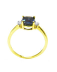 14K yellow gold ring with a vibrant oval blue sapphire and two natural diamonds on each side.