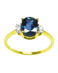 14k yellow gold women's blue sapphire ring 0.87 ct. oval cut, it is elegantly complemented by two natural diamonds on each side.