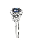 1.08 ct oval blue sapphire ring in 14K white gold with diamond halo.