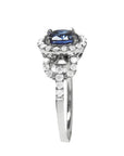 1.08 ct oval blue sapphire ring in 14K white gold with diamond halo.