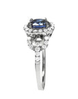 1.08 ct oval blue sapphire ring in 14K white gold with diamond halo.