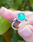 For her in birthday oval cut natural Colombian emerald medium deep green color 2.02 carats halo natural diamonds crafted in 14k white gold