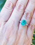 Bride's May birthstone emerald engagement ring medium deep green color 2.02 carats halo natural diamonds crafted in 14k white gold