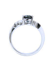 14K white gold ring with a 1.43 ct oval natural blue sapphire and accent diamonds.