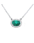 Natural Oval cut emerald necklace east west orientation halo natural diamonds prong set crafted in 14k white gold